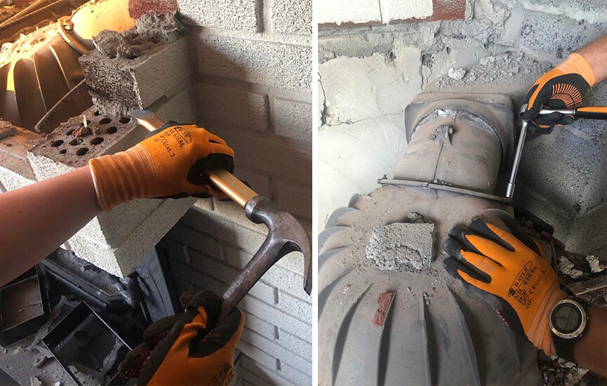 Kädet purkamassa vanhaa takkaa