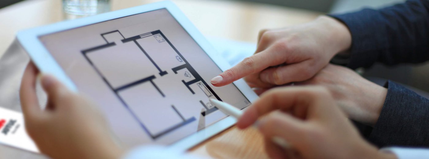 Kädet osoittavat iPadia Jøtul-luettelolla